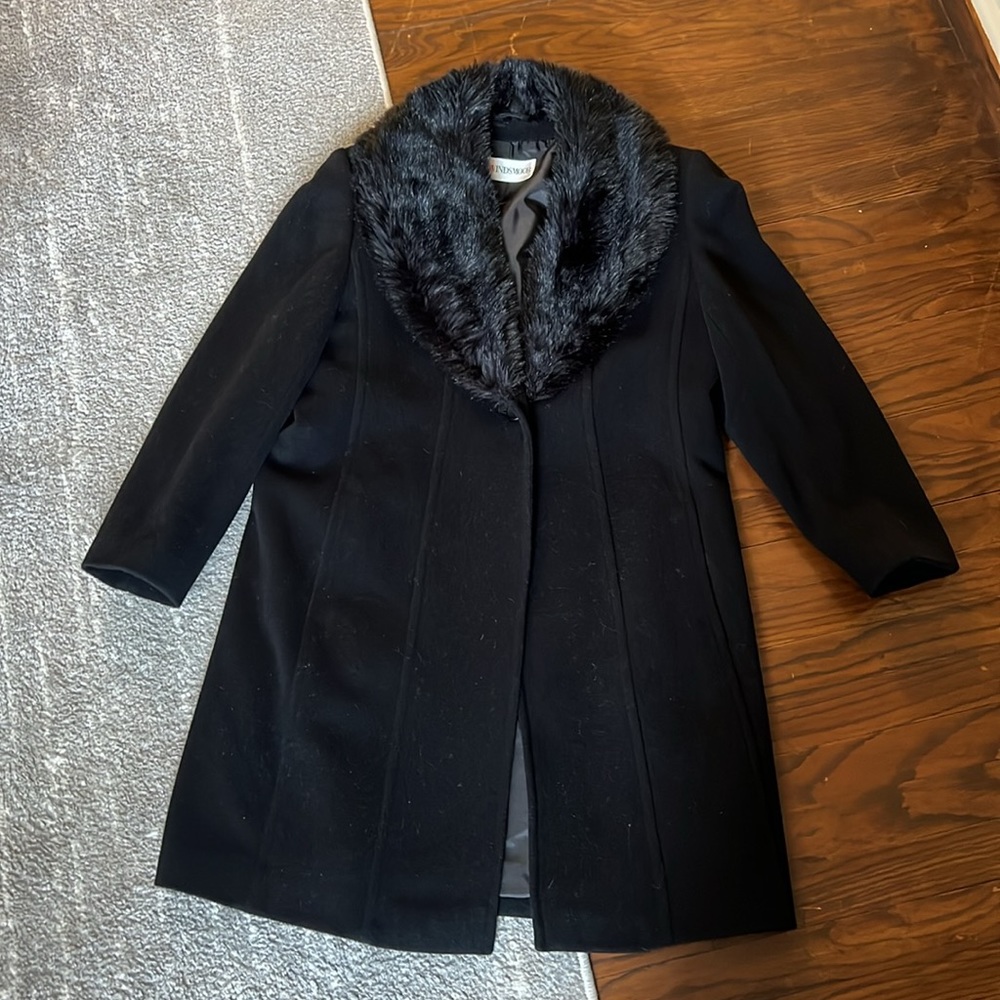 Black jacket with fur collar. Collar not removable.